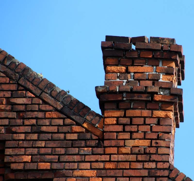 Signs Your Rosedale Home Needs a Chimney Inspection Damaged chimney on an Rosedale home showing cracks and missing mortar